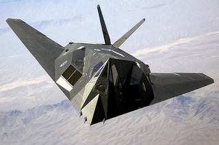 The flat, angled facets which deflect radar signals are clear in this head-on view of the F-117. (US Air Force)